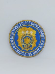 a round embroidery custom patch for yc police department champlains unit on blue twill yellow logo and white thread letters